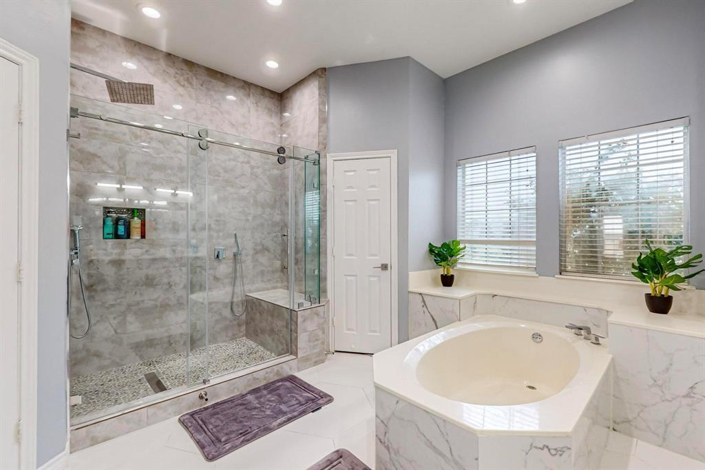 4908 Glenwood Lane Anna, TX 75409 - Photo 12 of 34 Primary bathroom featuring a garden tub, a marble finish shower, and recessed lighting