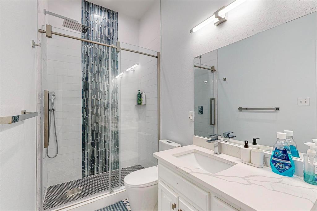 4908 Glenwood Lane Anna, TX 75409 - Photo 17 of 34 Bathroom featuring a stall shower and vanity