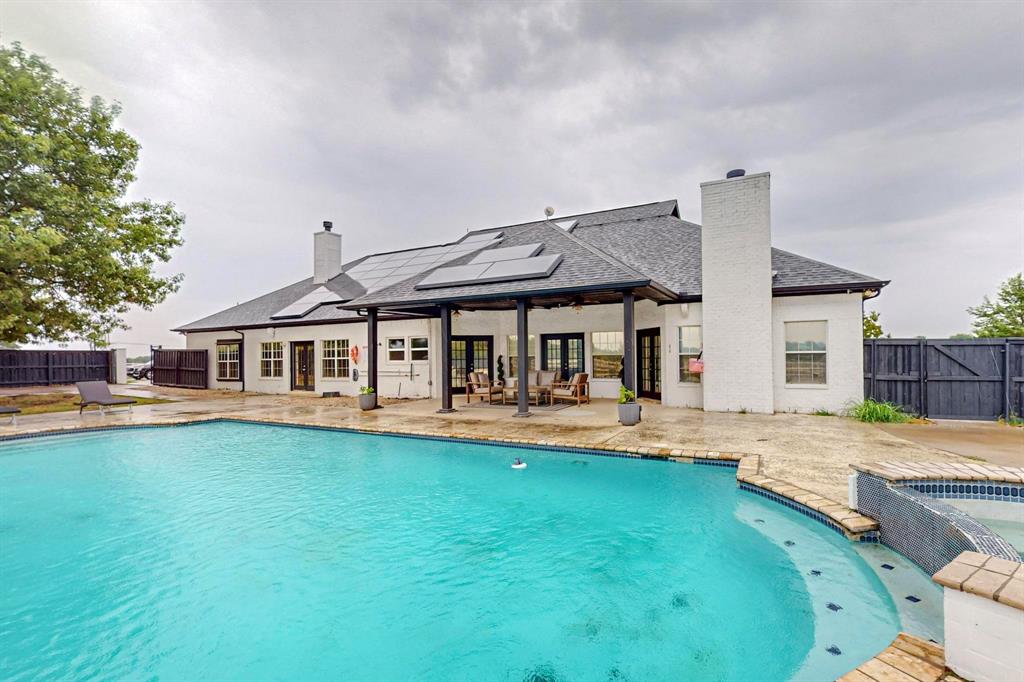 4908 Glenwood Lane Anna, TX 75409 - Photo 24 of 34 View of swimming pool with a fenced backyard, a patio area, french doors, and a pool with connected hot tub