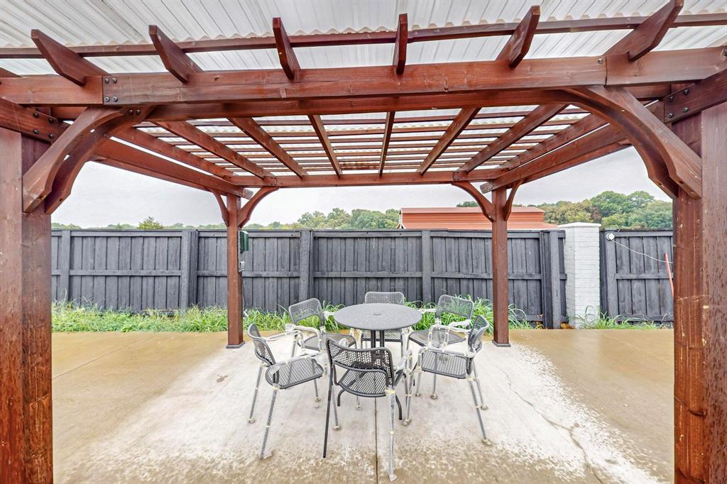 4908 Glenwood Lane Anna, TX 75409 - Photo 26 of 34 Fenced backyard with outdoor dining area, a patio area, and a pergola