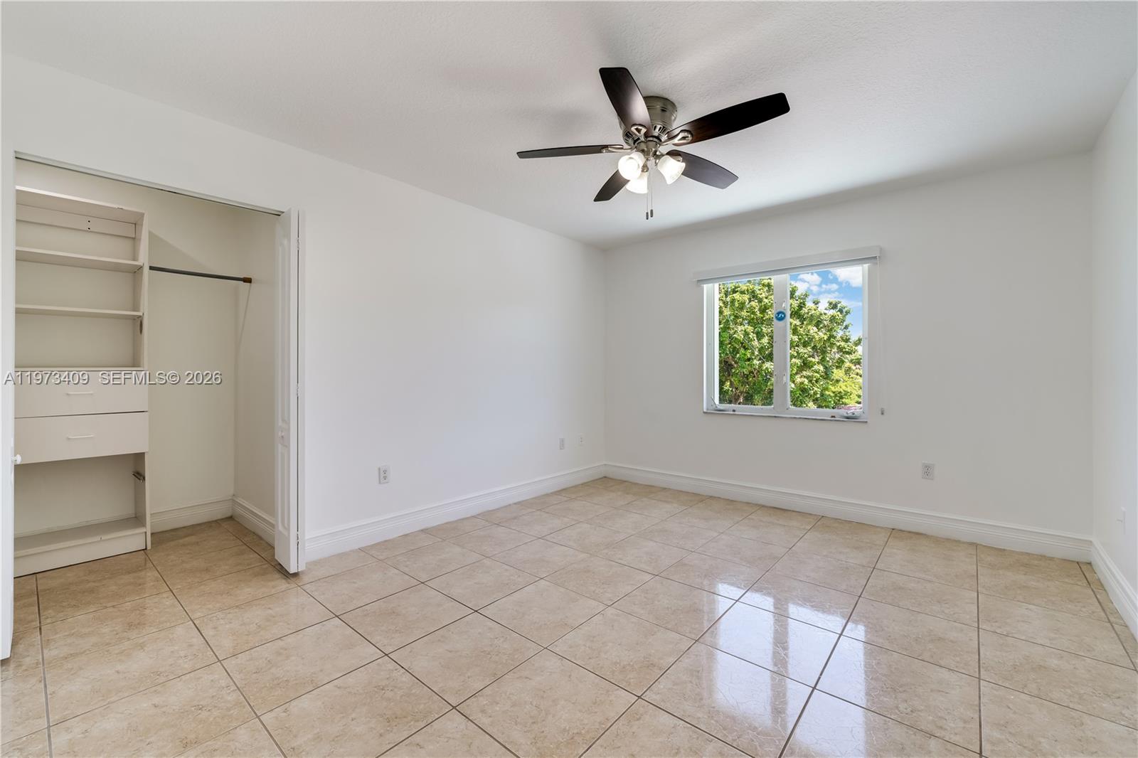 13050 Southwest 26th Street Miami, FL 33175 - Photo 18 of 43 a view of an empty room with a window