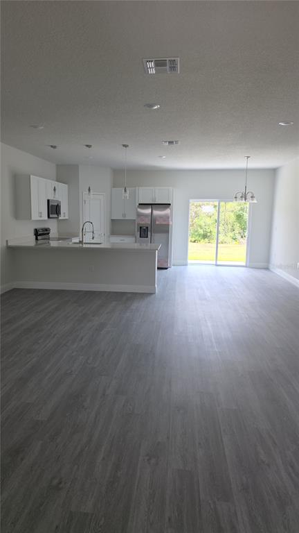 2500 Southwest 156th Lane Road Ocala, FL 34473 - Photo 11 of 15 a view of kitchen and empty room with a window