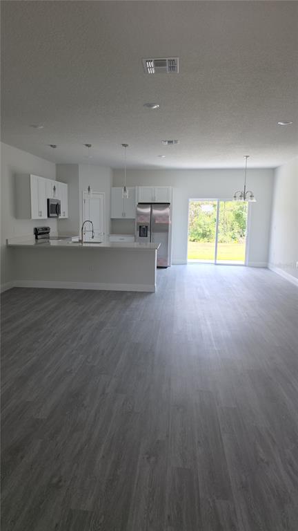 2500 Southwest 156th Lane Road Ocala, FL 34473 - Photo 12 of 15 a view of kitchen and empty room with a window