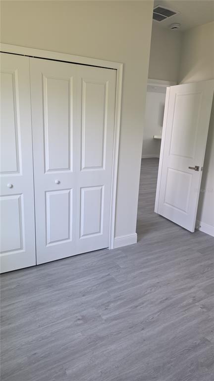 2500 Southwest 156th Lane Road Ocala, FL 34473 - Photo 14 of 15 a view of empty room with wooden floor