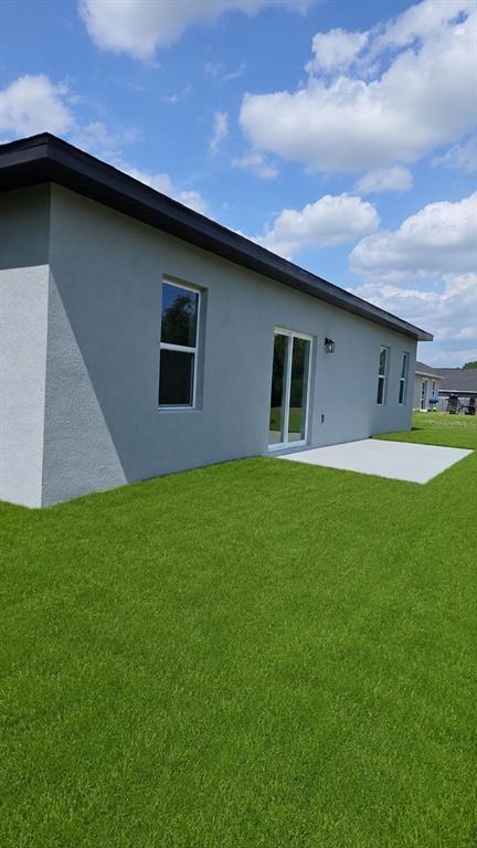 2500 Southwest 156th Lane Road Ocala, FL 34473 - Photo 15 of 15 a backyard of a house with lots of green space