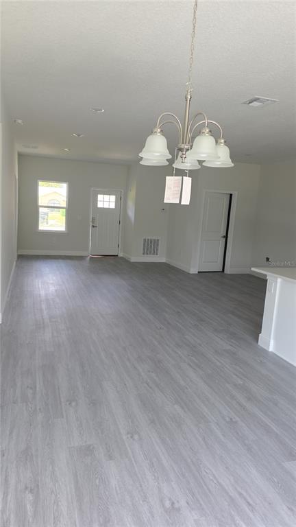 2500 Southwest 156th Lane Road Ocala, FL 34473 - Photo 3 of 15 a view of a livingroom with furniture and wooden floor
