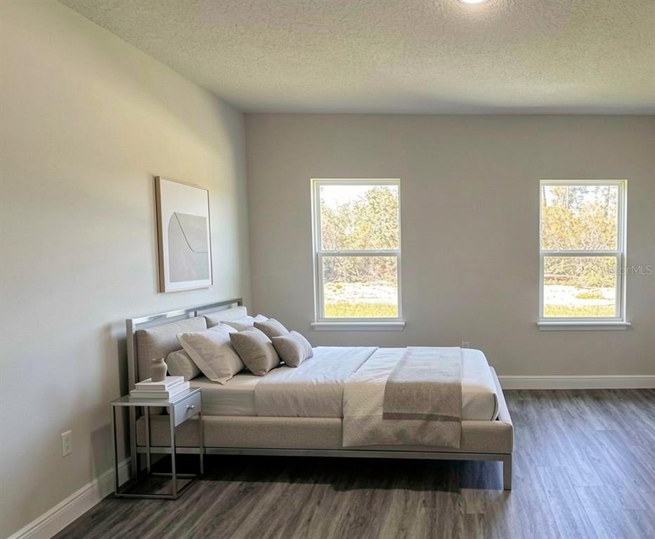 2500 Southwest 156th Lane Road Ocala, FL 34473 - Photo 4 of 15 a bedroom with a bed and window