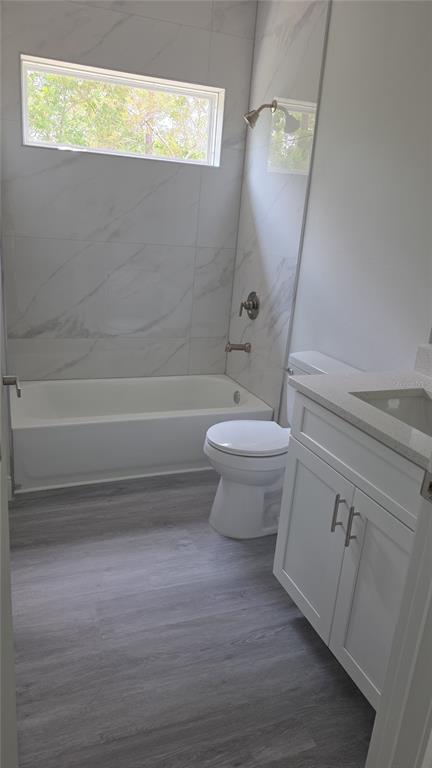 2500 Southwest 156th Lane Road Ocala, FL 34473 - Photo 7 of 15 a bathroom with a toilet a sink and bathtub
