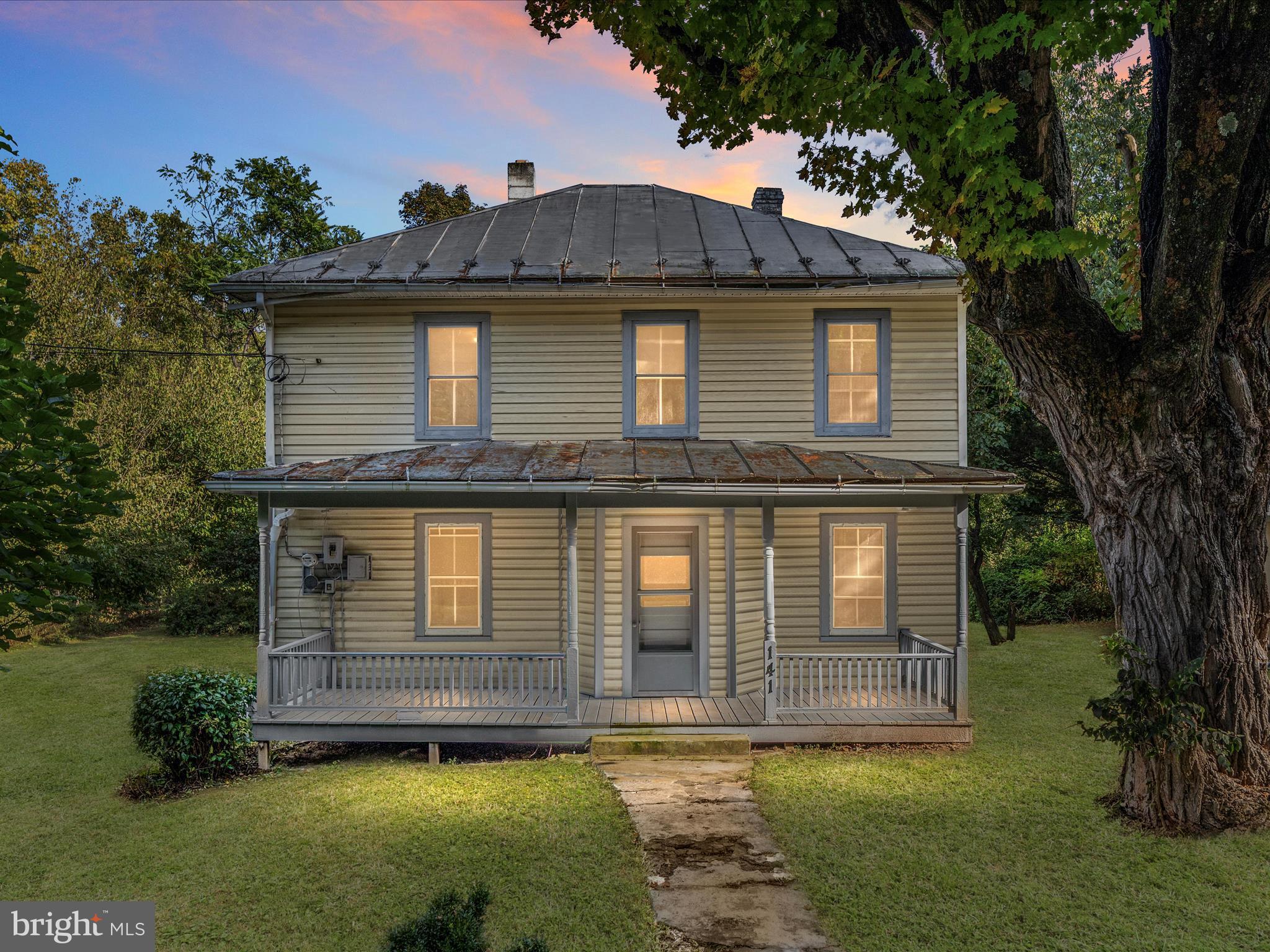 141 Back Creek Road Gore, VA 22637 - Photo 2 of 53 a front view of a house with a garden