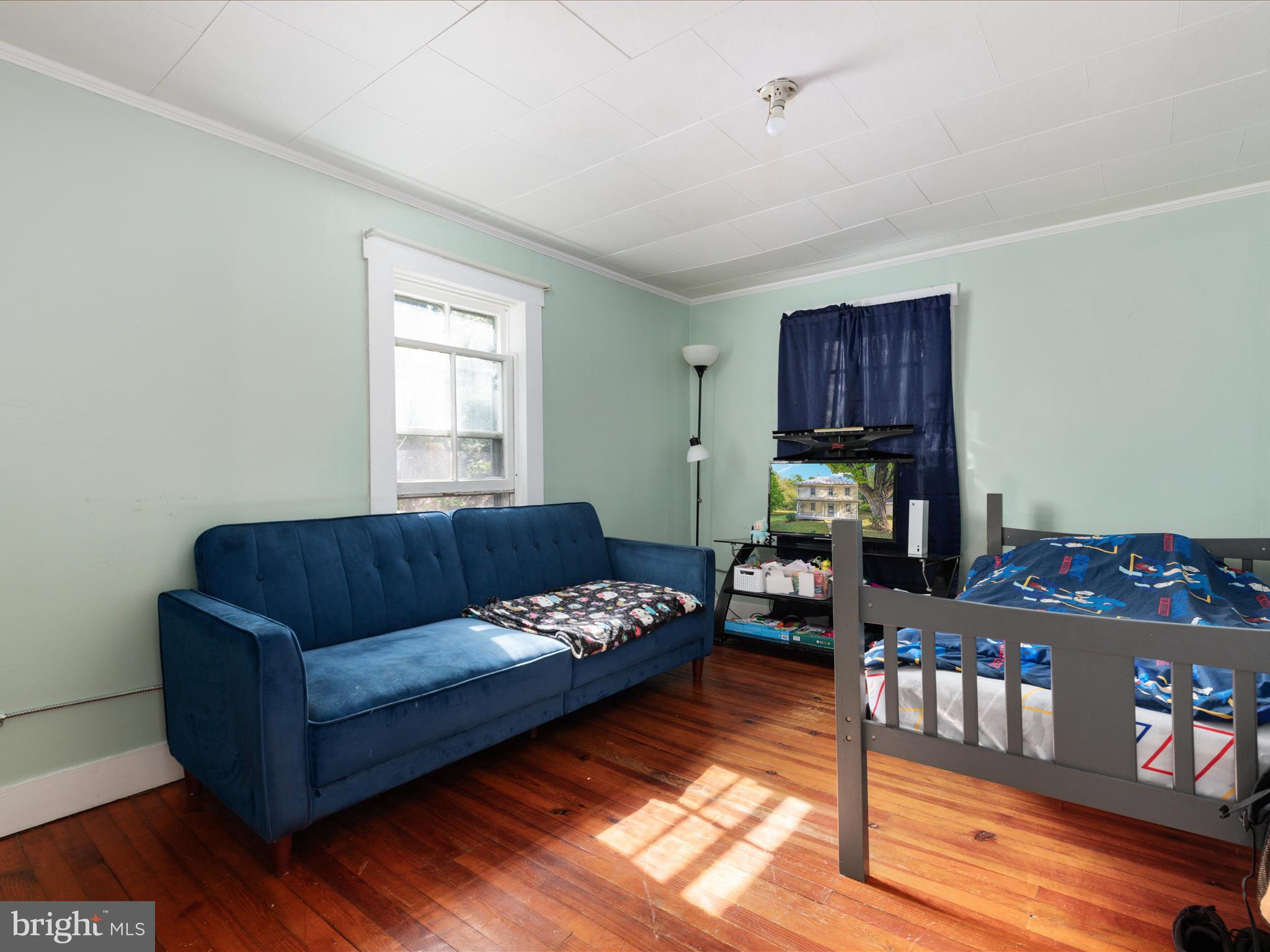 141 Back Creek Road Gore, VA 22637 - Photo 22 of 53 a living room with furniture and a window