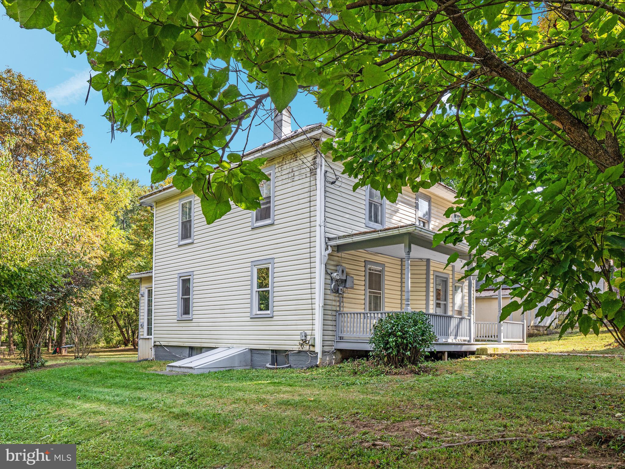 141 Back Creek Road Gore, VA 22637 - Photo 36 of 53 a front view of a house with a yard and trees