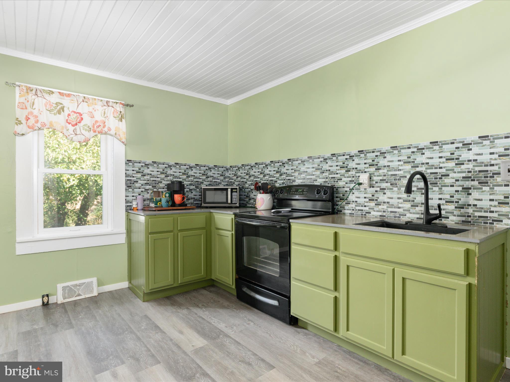 141 Back Creek Road Gore, VA 22637 - Photo 8 of 53 a kitchen with a sink and a stove top oven