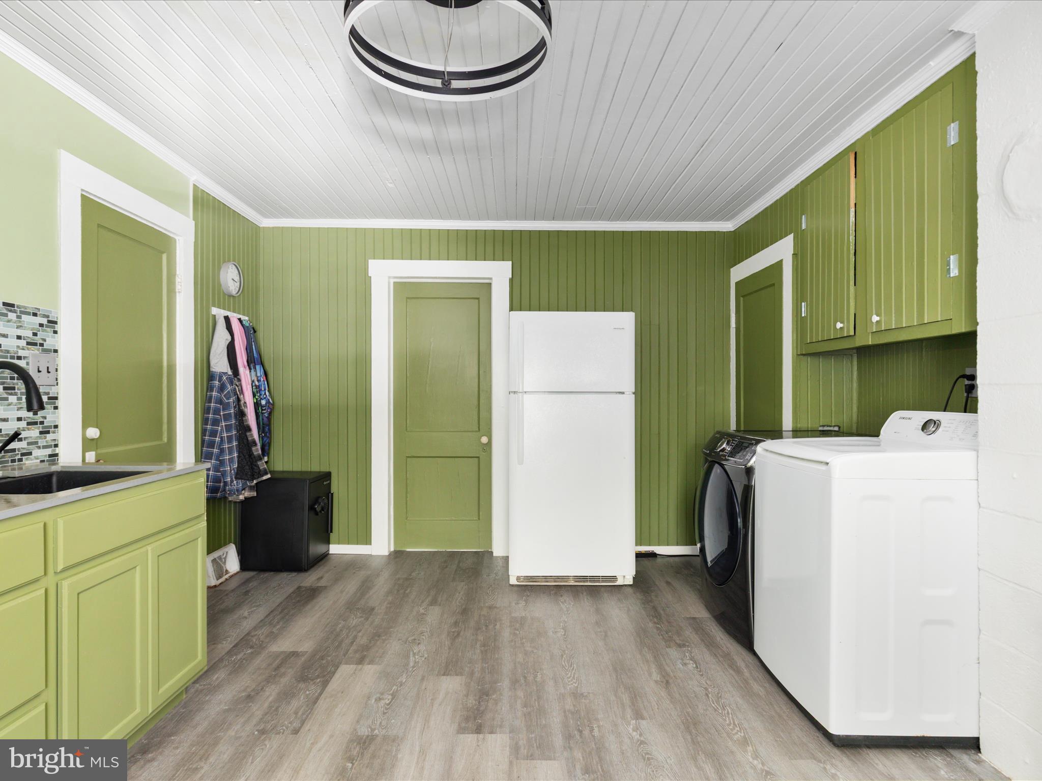 141 Back Creek Road Gore, VA 22637 - Photo 10 of 53 a view of kitchen with refrigerator and wooden floor