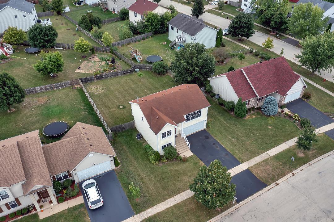 303 Joshua Tree Harvard, IL 60033 - Photo 14 of 14 an aerial view of house with backyard space and swimming pool
