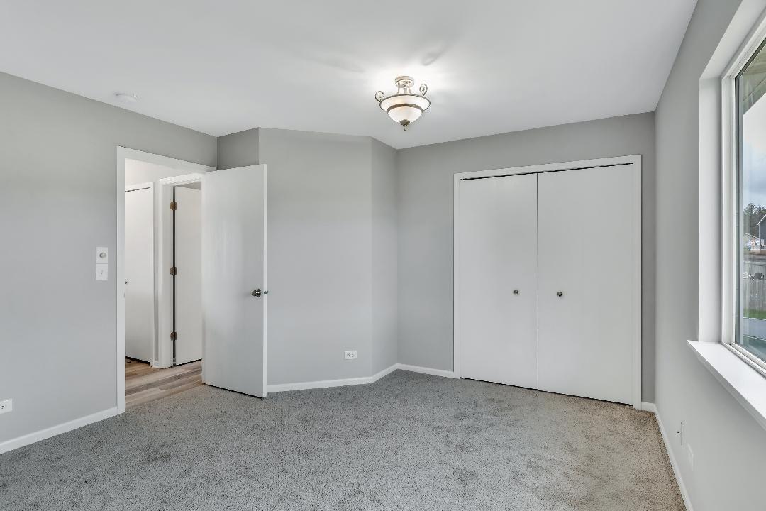 303 Joshua Tree Harvard, IL 60033 - Photo 5 of 14 a view of an empty room