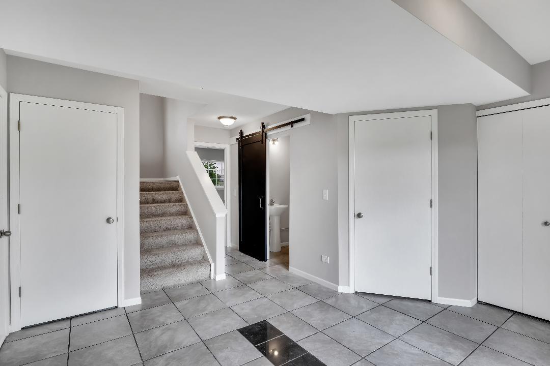 303 Joshua Tree Harvard, IL 60033 - Photo 9 of 14 a view of entryway with stairs