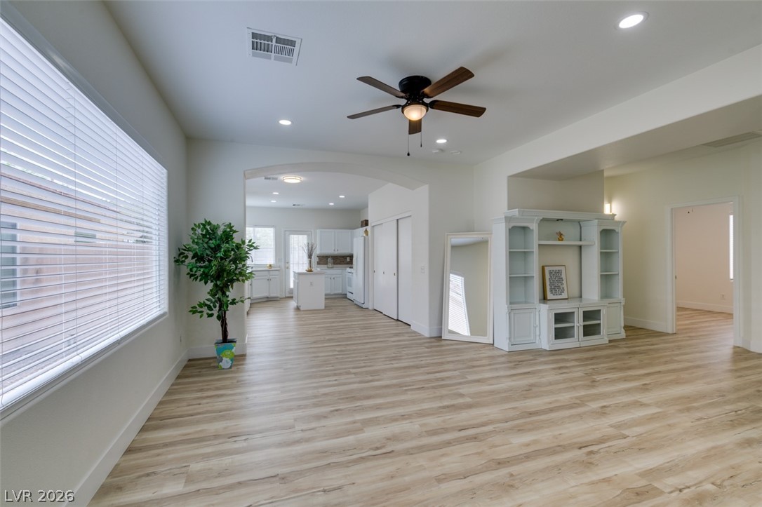 Natural light illuminates the wide living room/foyer of 10959 Pumpkin Ridge Ave LV, NV 89135 leading into an inviting living room area.