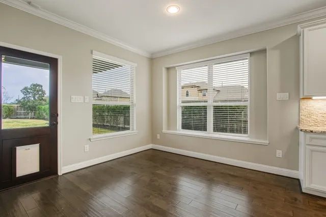 a view of kitchen with cabinets and wooden floor