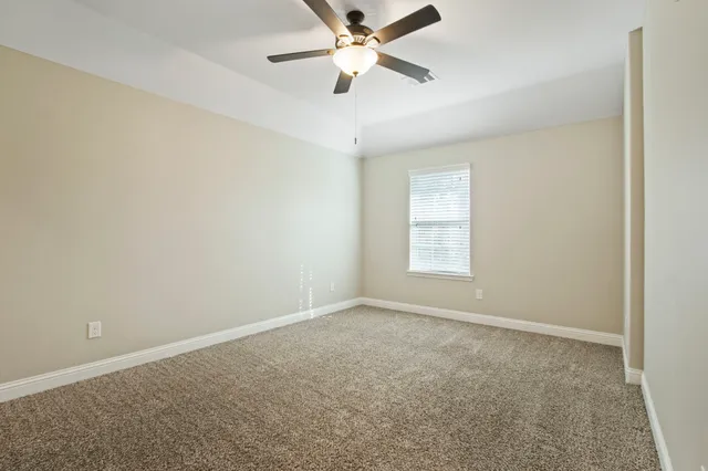 a view of a big room with carpet