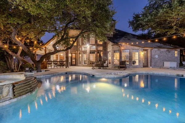 a view of pool with outdoor seating