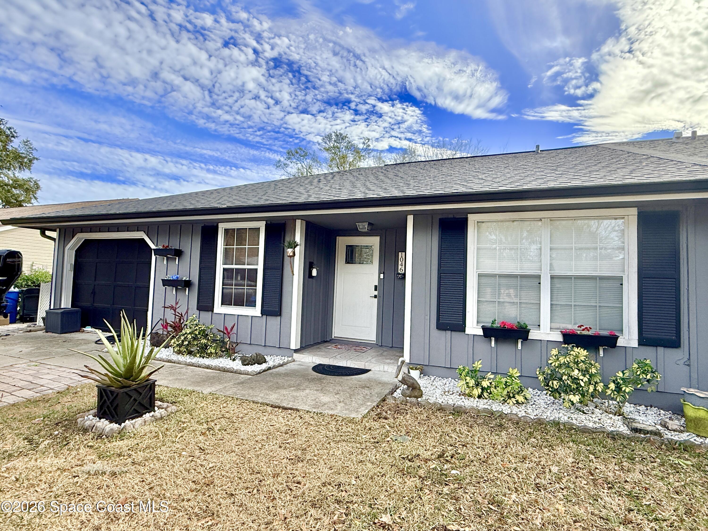 1046 West Samms Avenue Port Orange, FL 32129 - Photo 28 of 53 a front view of a house with a porch