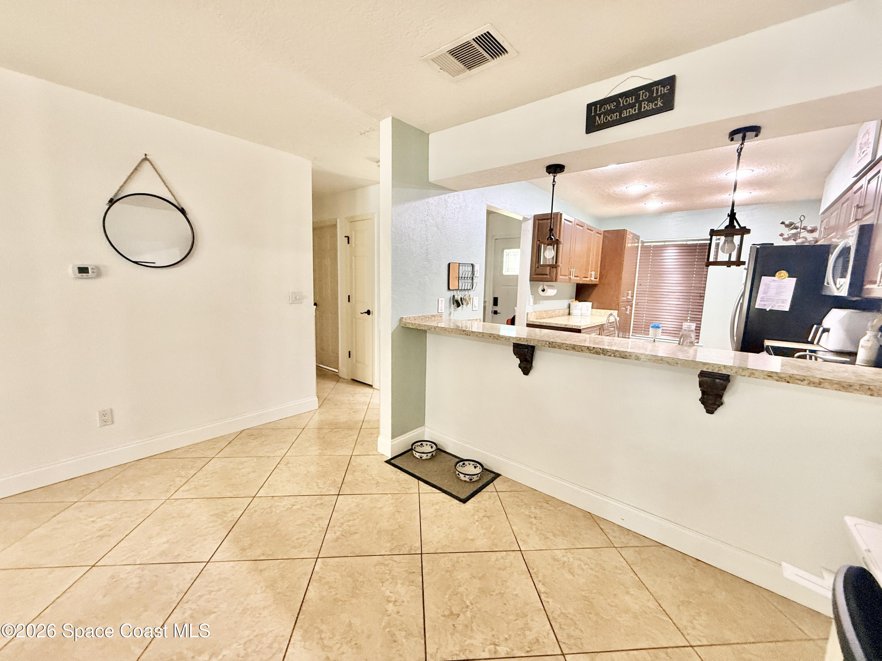 1046 West Samms Avenue Port Orange, FL 32129 - Photo 34 of 53 a kitchen with stainless steel appliances a sink and cabinets