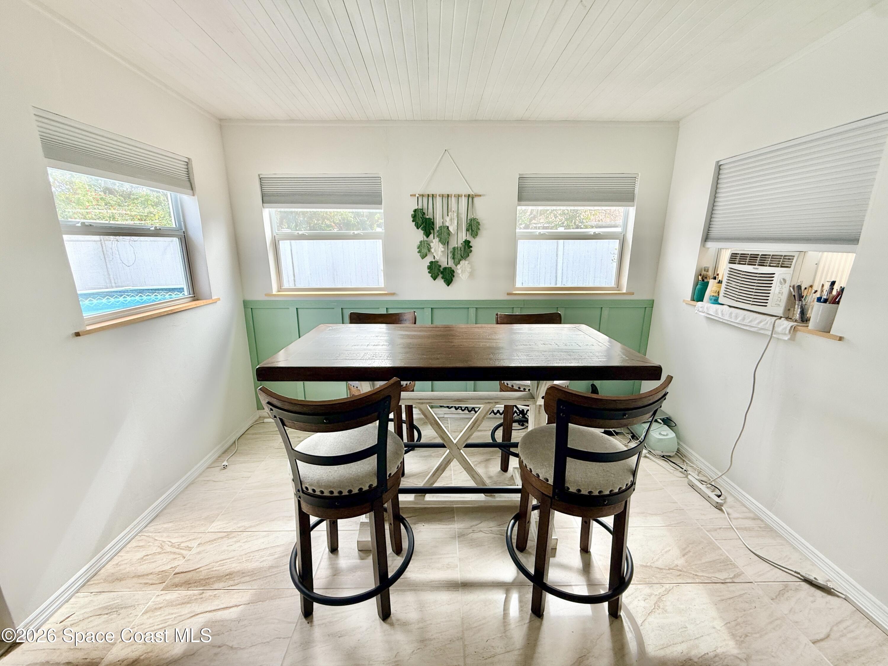 1046 West Samms Avenue Port Orange, FL 32129 - Photo 4 of 53 a view of a dining room with furniture and window