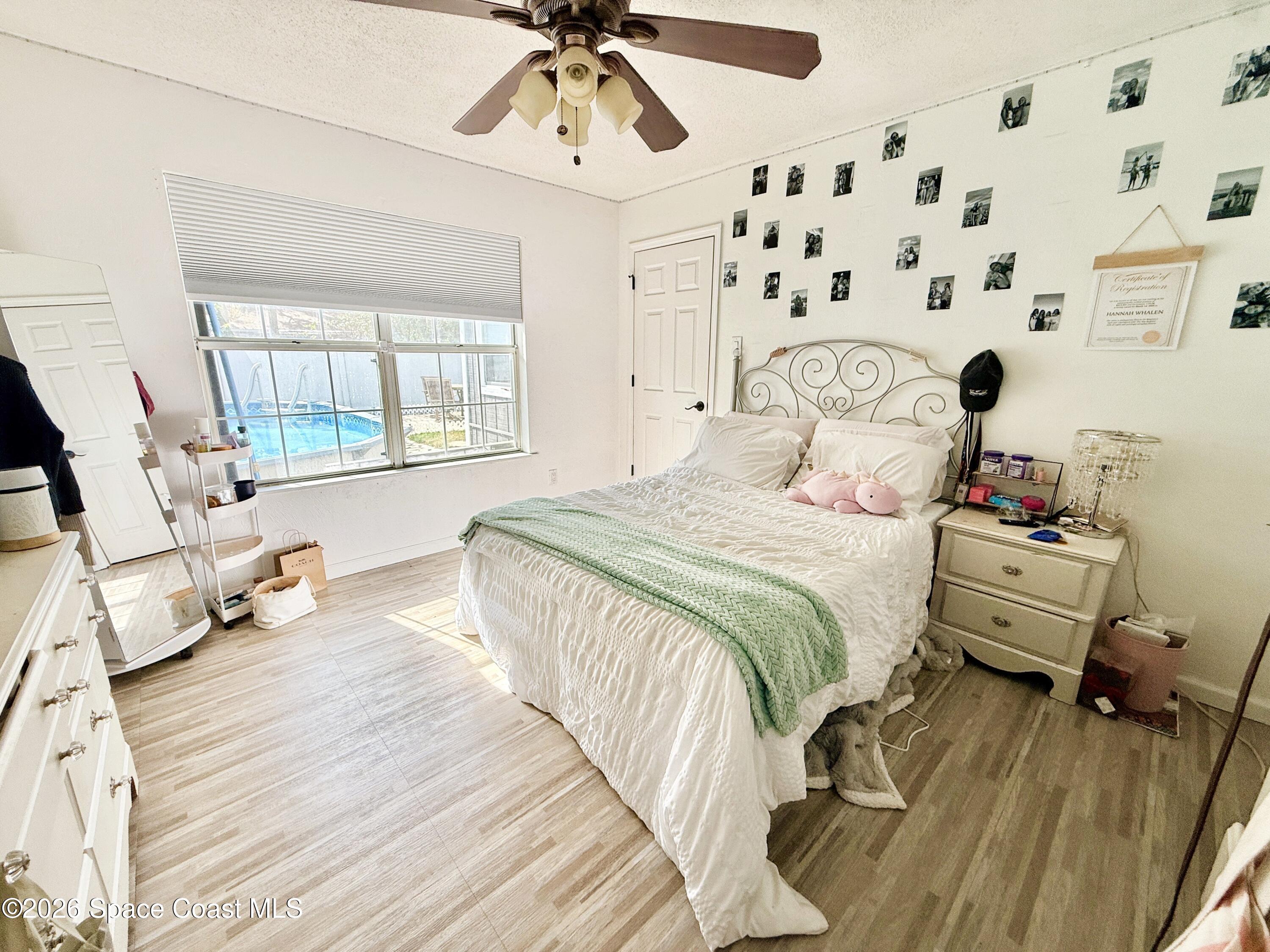 1046 West Samms Avenue Port Orange, FL 32129 - Photo 43 of 53 a bedroom with a bed and wooden floor