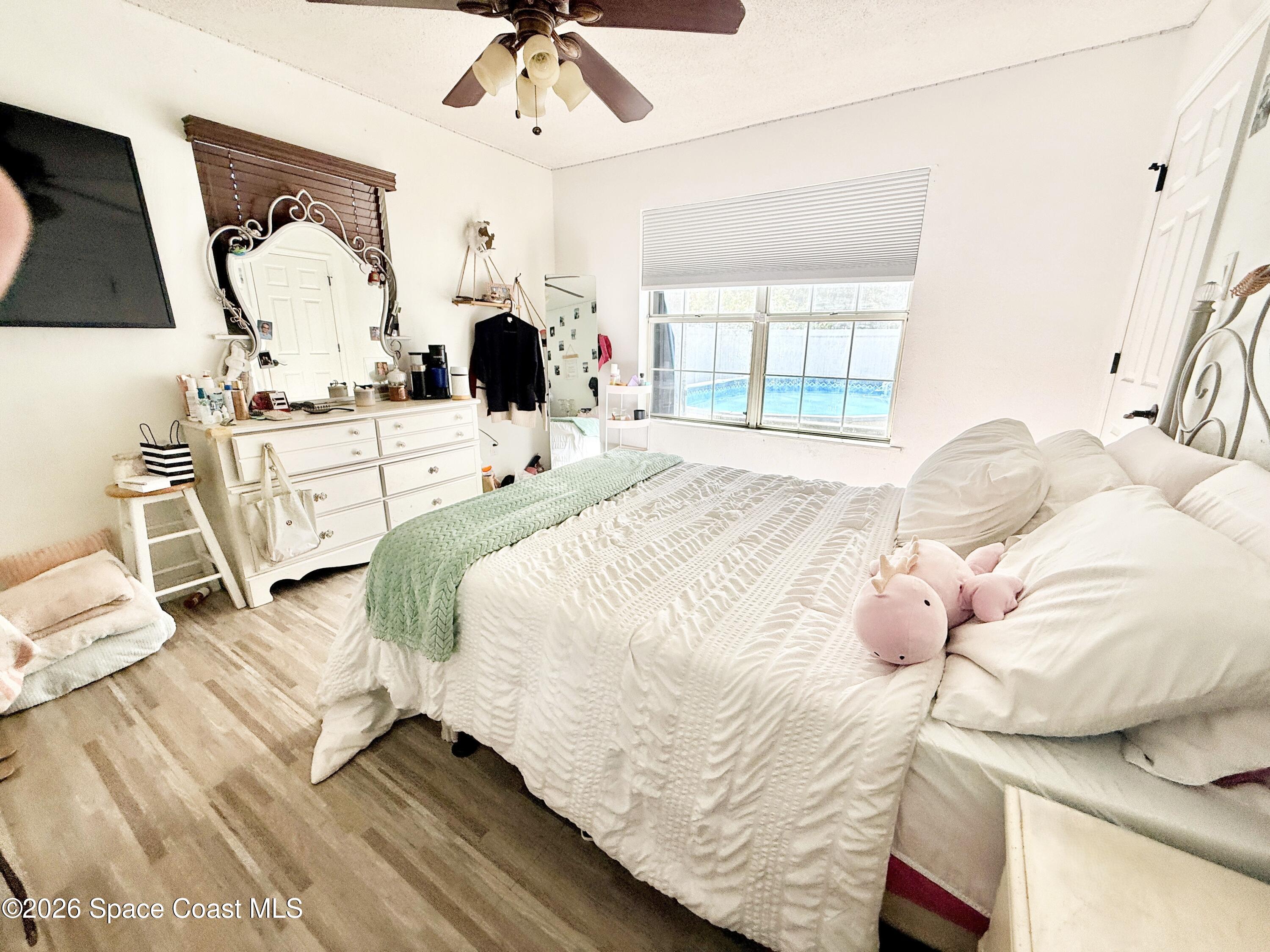 1046 West Samms Avenue Port Orange, FL 32129 - Photo 44 of 53 a bedroom with a bed mirror and window