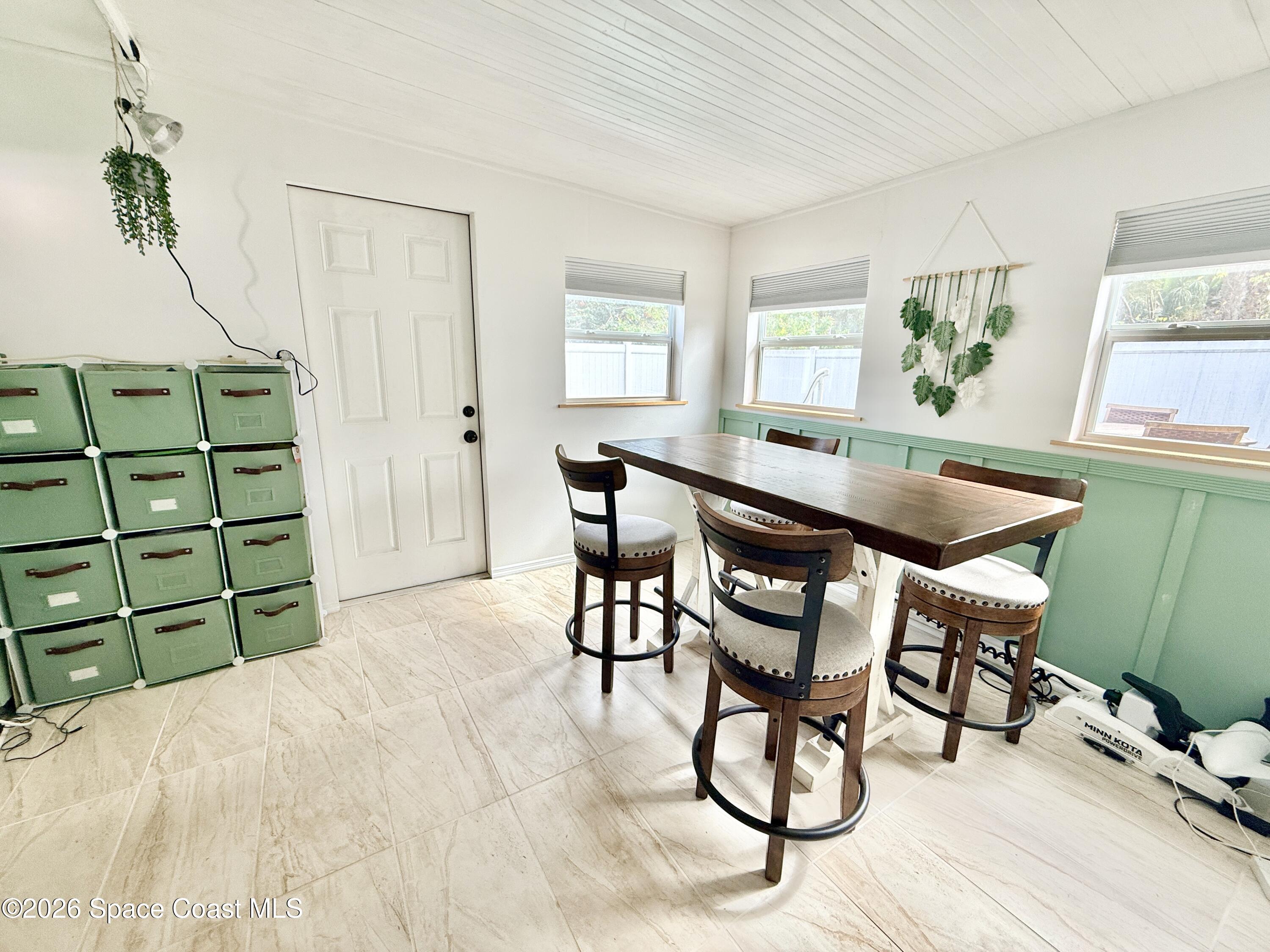 1046 West Samms Avenue Port Orange, FL 32129 - Photo 5 of 53 a dining room with furniture and window