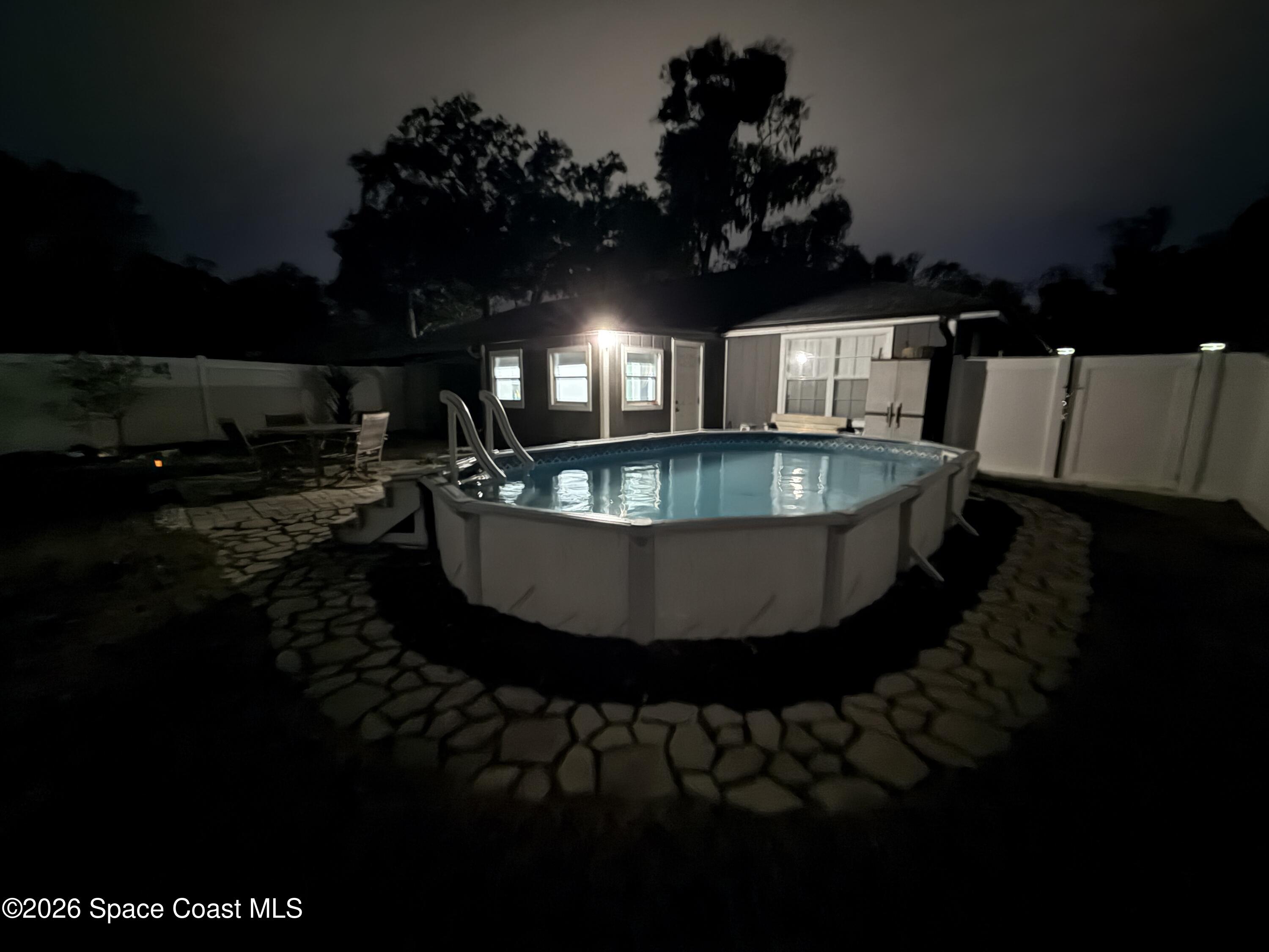 1046 West Samms Avenue Port Orange, FL 32129 - Photo 53 of 53 a view of a swimming pool in back of the kitchen