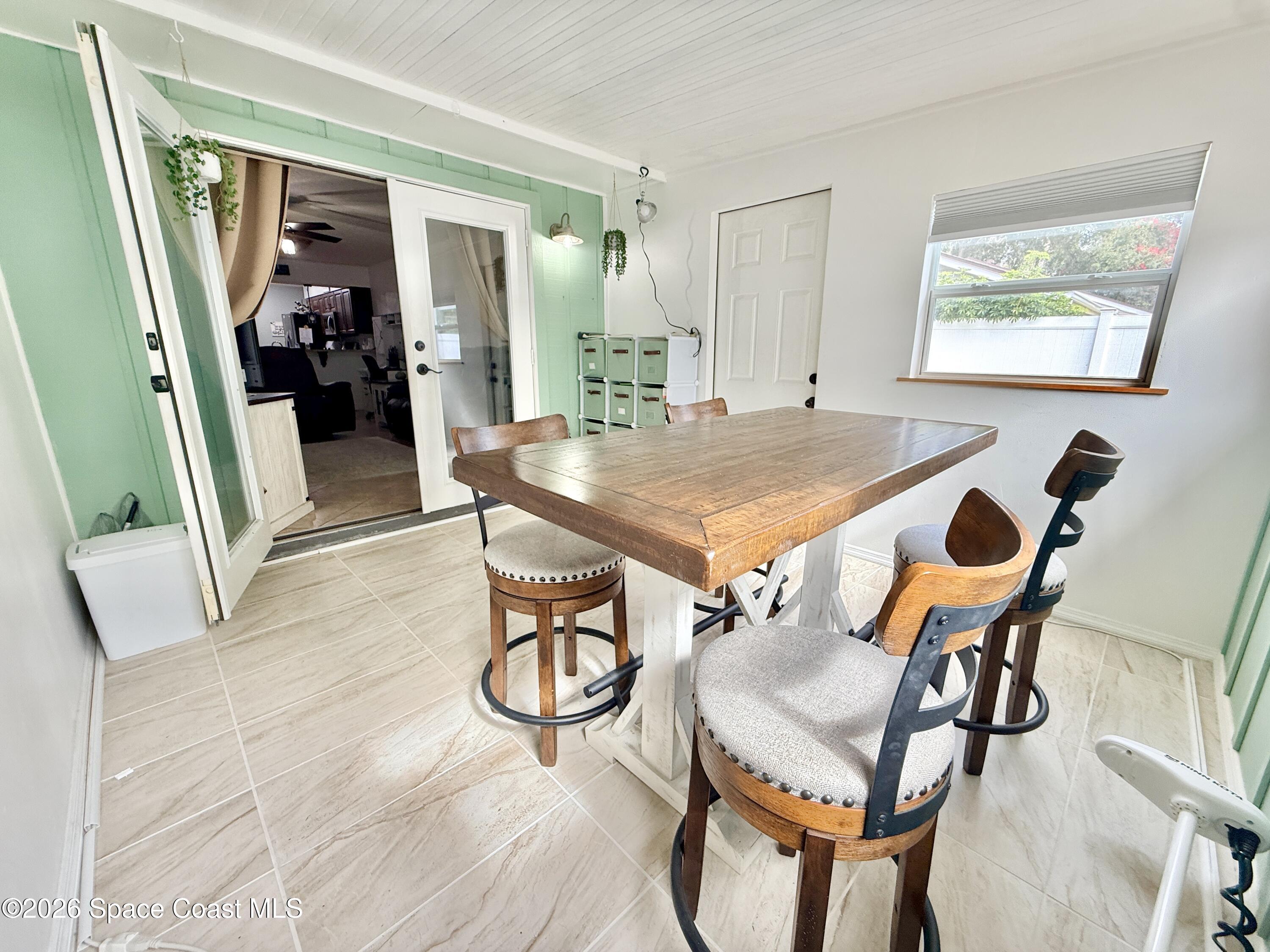 1046 West Samms Avenue Port Orange, FL 32129 - Photo 6 of 53 a dining room with furniture and window