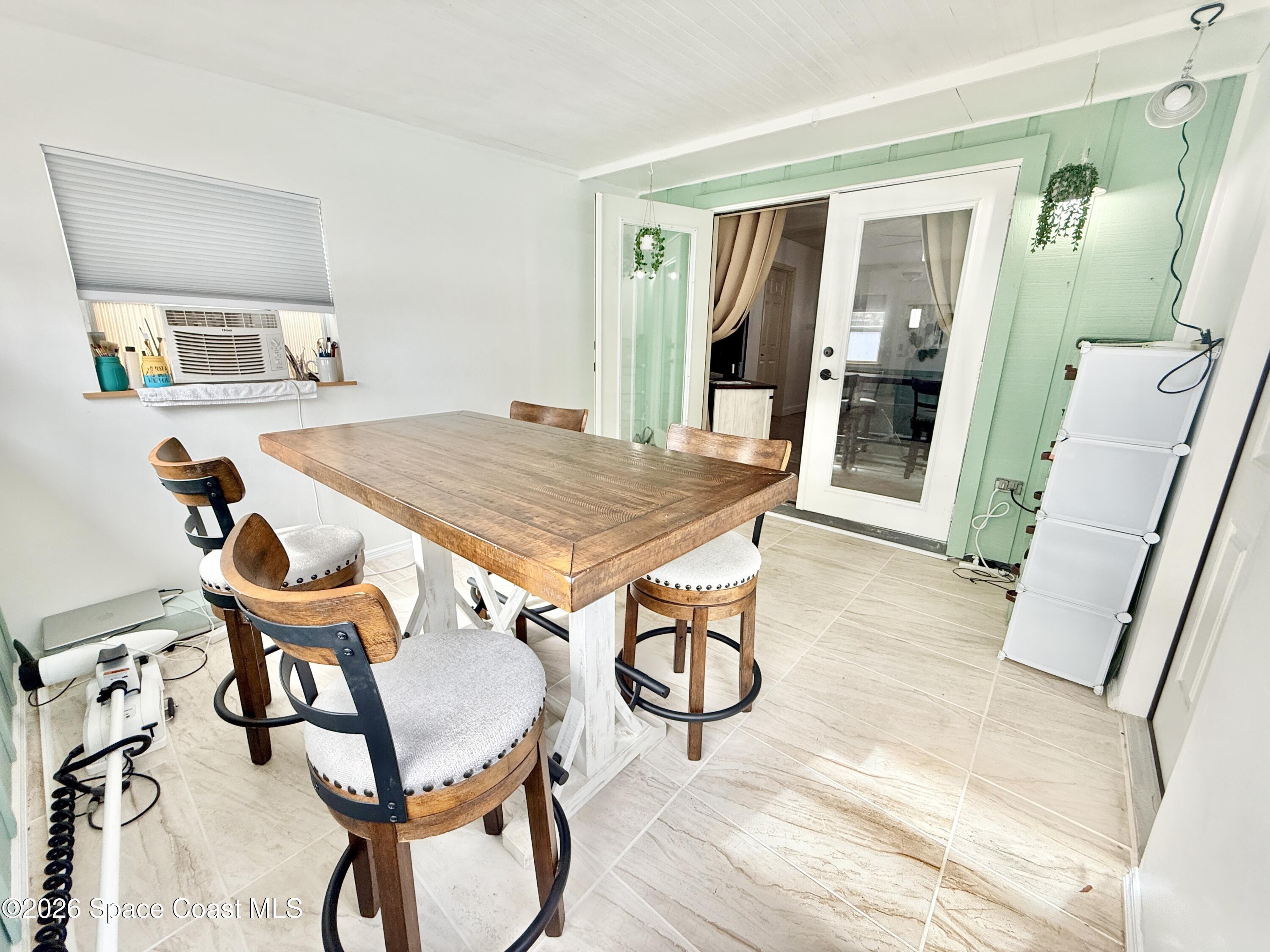 1046 West Samms Avenue Port Orange, FL 32129 - Photo 7 of 53 a dining room with furniture and window