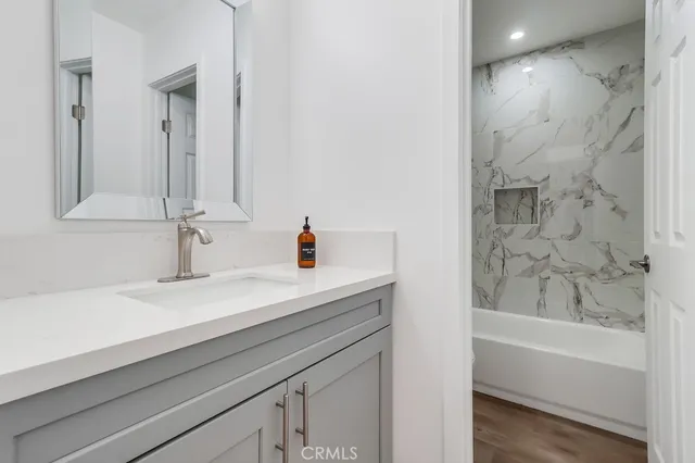 a bathroom with a bathtub and a sink