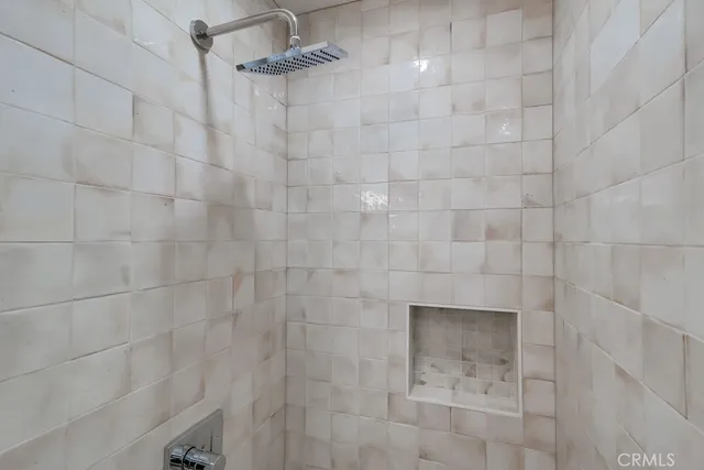 a view of a room with wooden floor and window