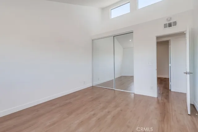 a view of wooden floor in an empty room