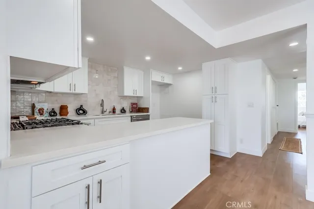 a view of kitchen with wooden floor