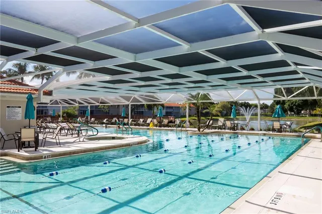 a view of a swimming pool with a patio