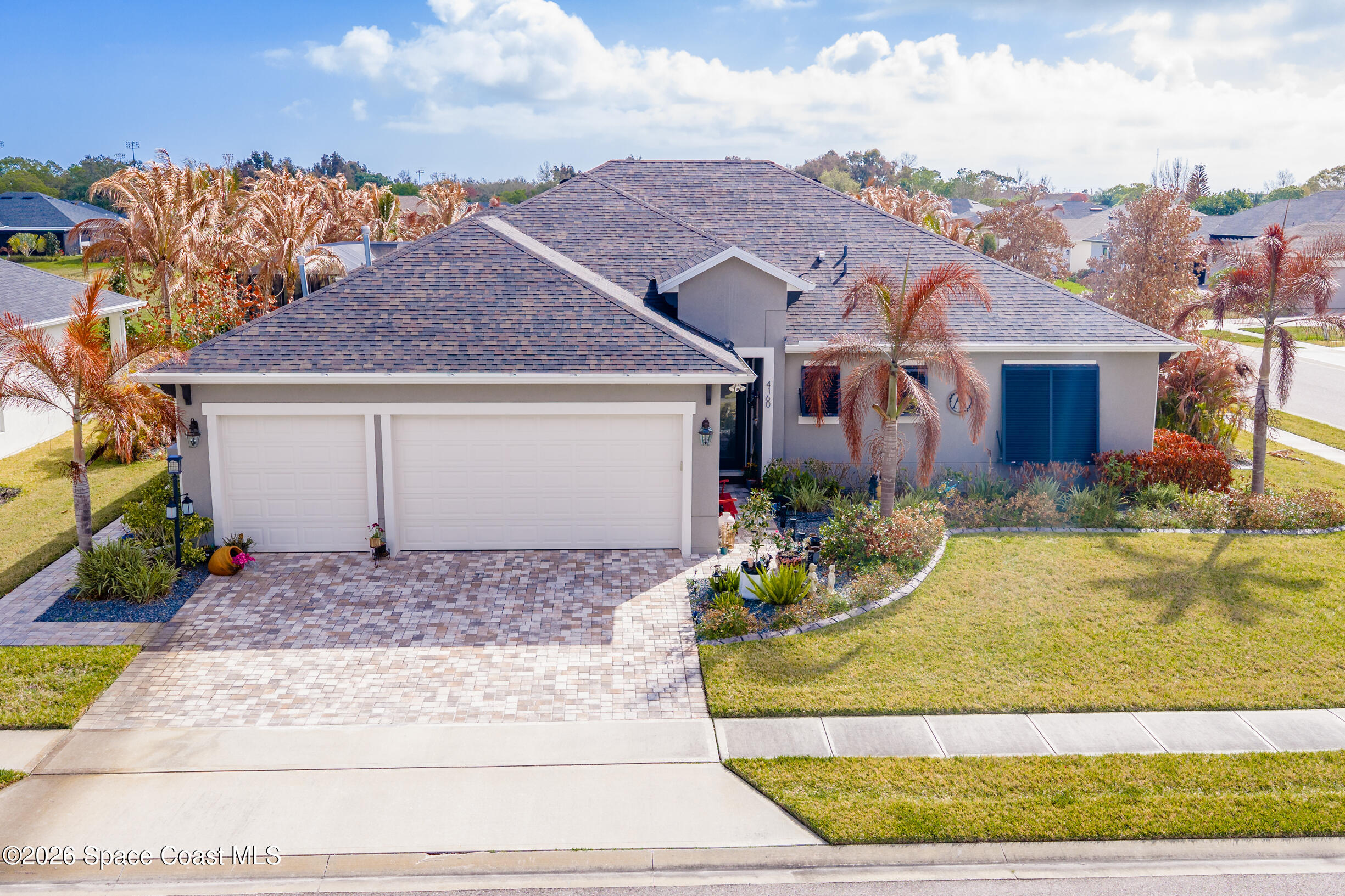 4160 Negal Circle Melbourne, FL 32901 - Photo 1 of 61 a front view of a house with a garden