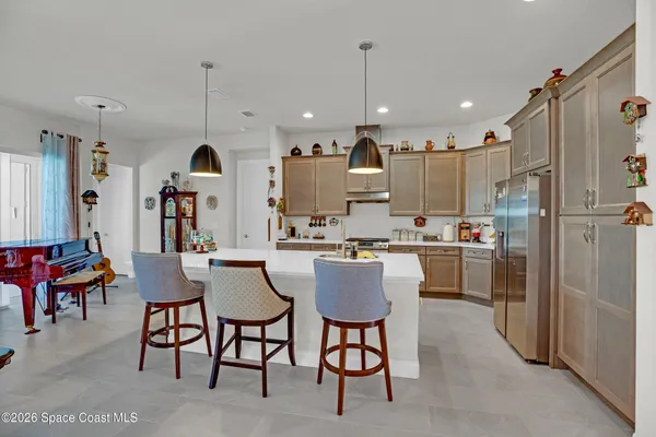a kitchen with stainless steel appliances kitchen island granite countertop a sink and cabinets