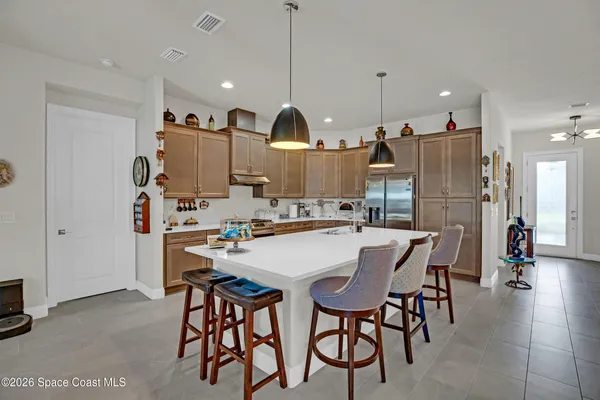 a kitchen with sink cabinets and window