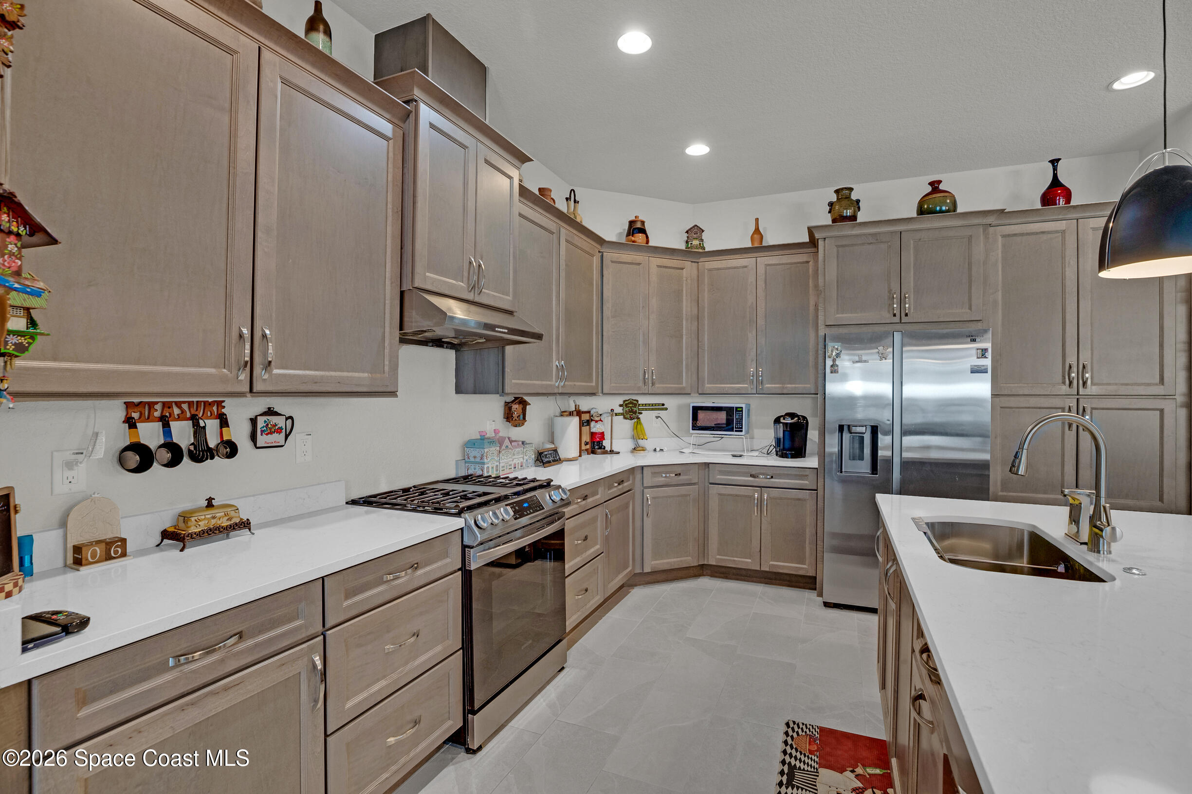 4160 Negal Circle Melbourne, FL 32901 - Photo 15 of 61 a kitchen with sink cabinets and window