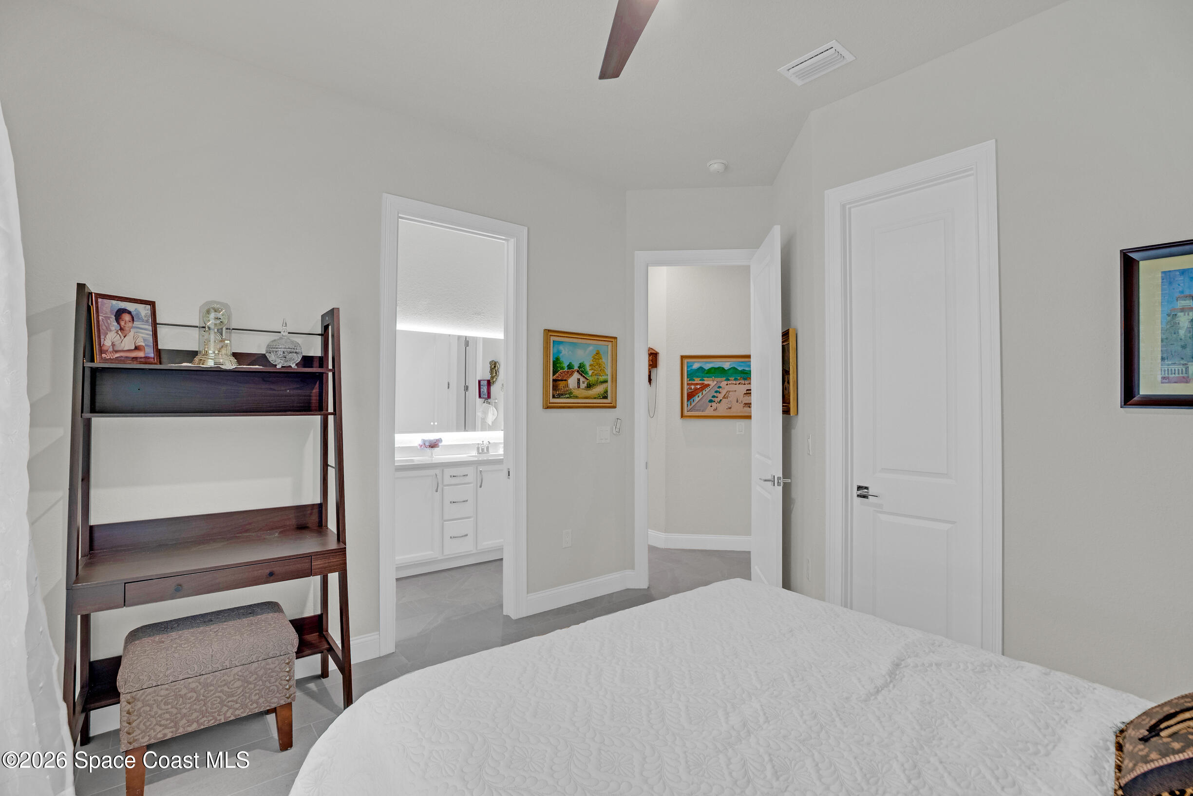 4160 Negal Circle Melbourne, FL 32901 - Photo 24 of 61 a bedroom with a bed and furniture