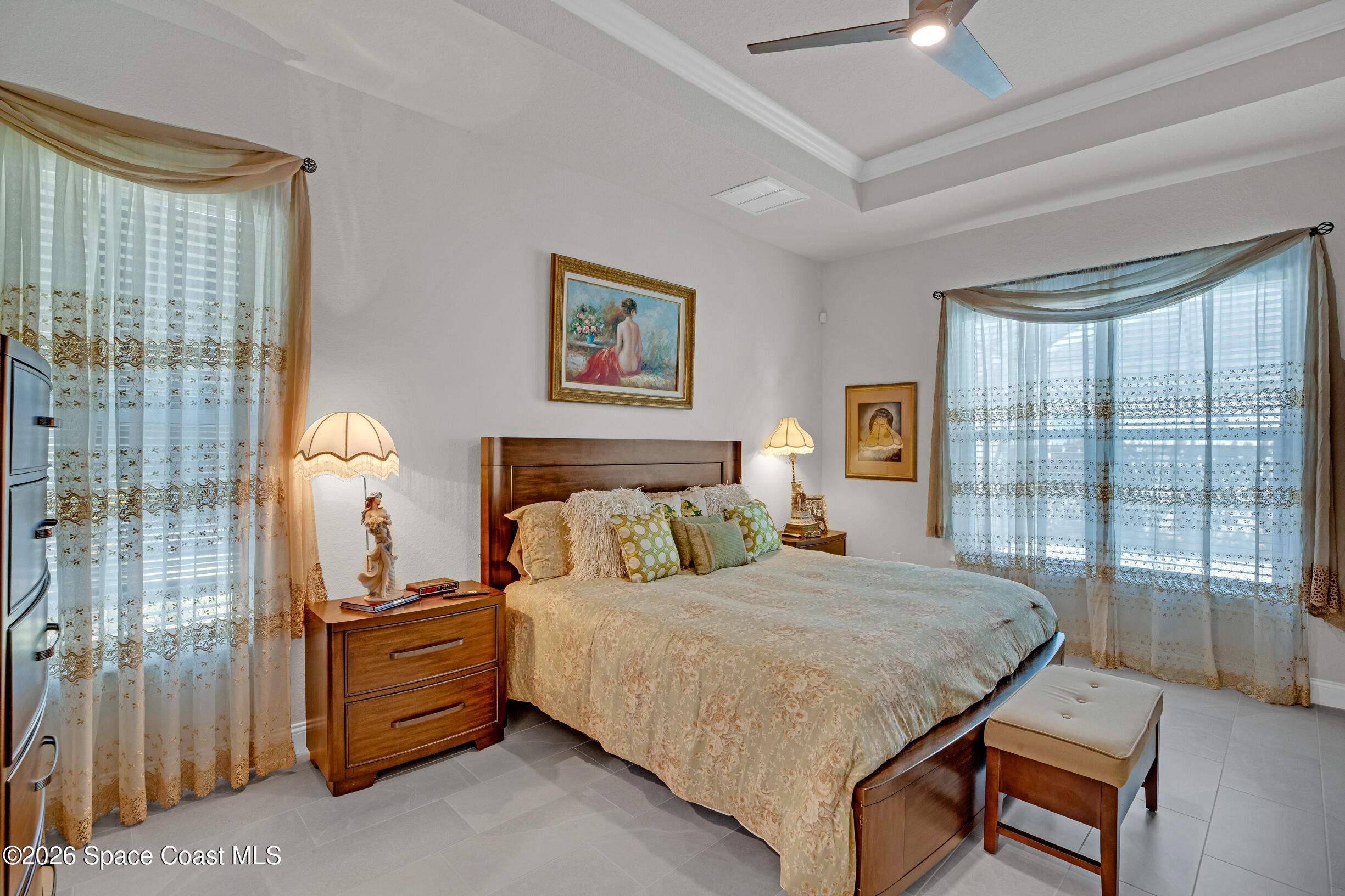 4160 Negal Circle Melbourne, FL 32901 - Photo 29 of 61 a bedroom with a bed and wooden floor