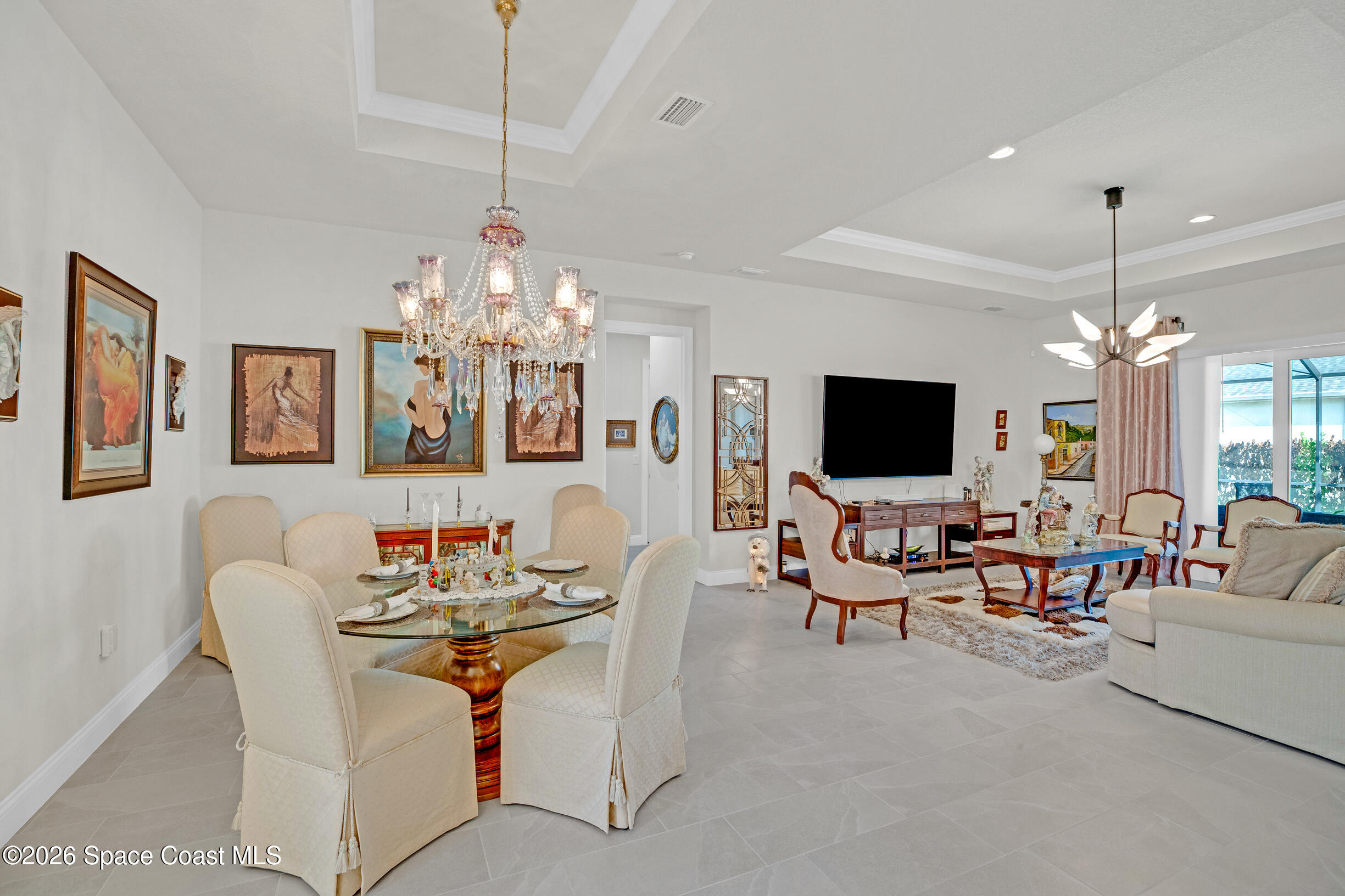 4160 Negal Circle Melbourne, FL 32901 - Photo 3 of 61 a view of a livingroom and a dining room with furniture window and wooden floor