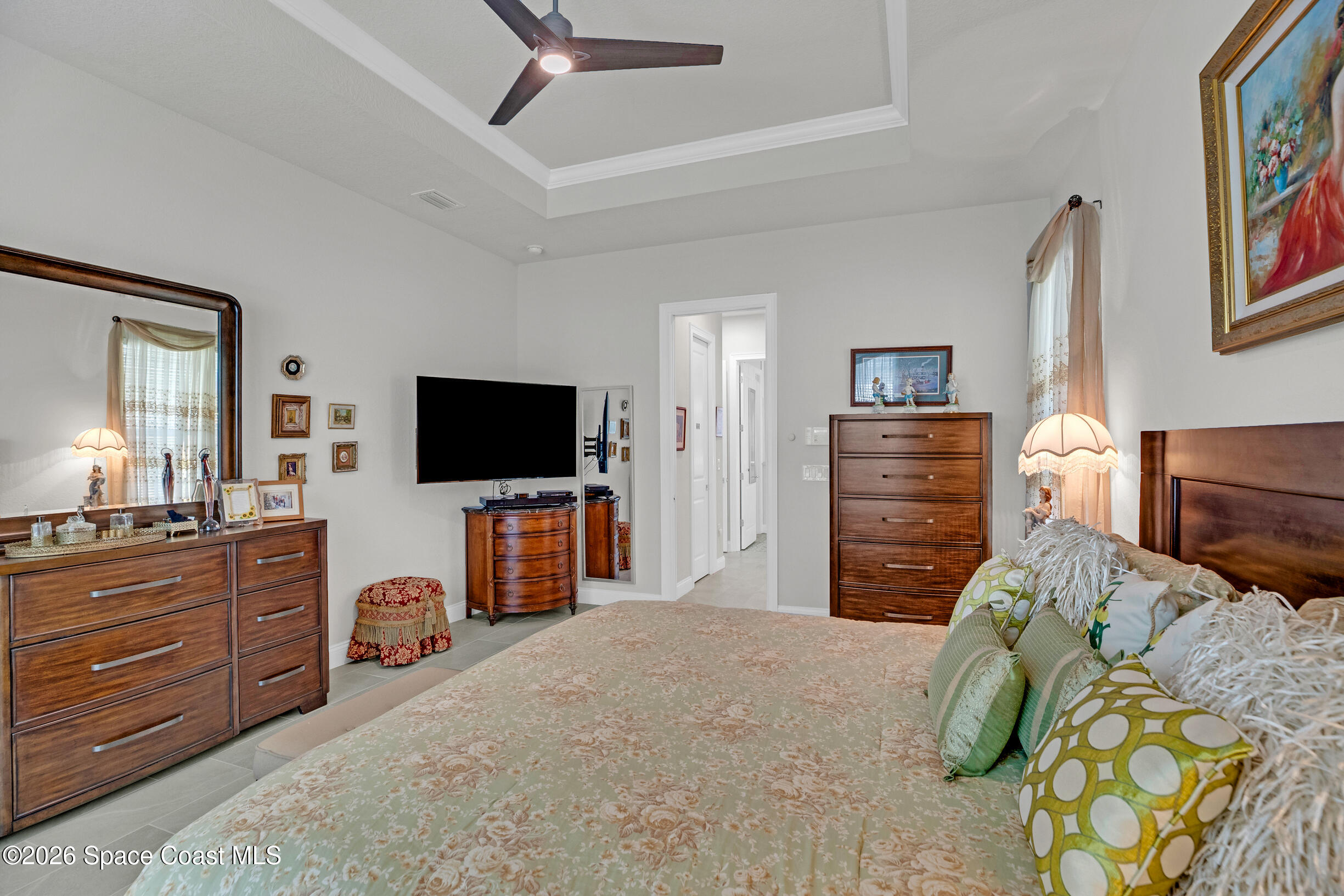 4160 Negal Circle Melbourne, FL 32901 - Photo 31 of 61 a bedroom with a bed and flat screen tv