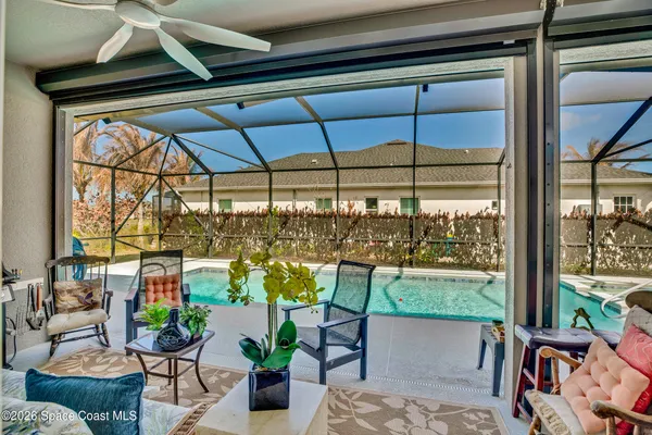 an aerial view of residential house with outdoor space and swimming pool