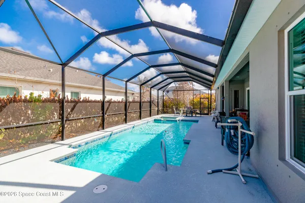 a aerial view of a house with a yard