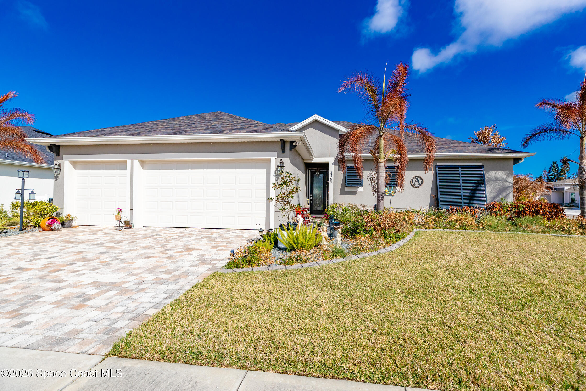 4160 Negal Circle Melbourne, FL 32901 - Photo 43 of 61 a front view of a house with a yard