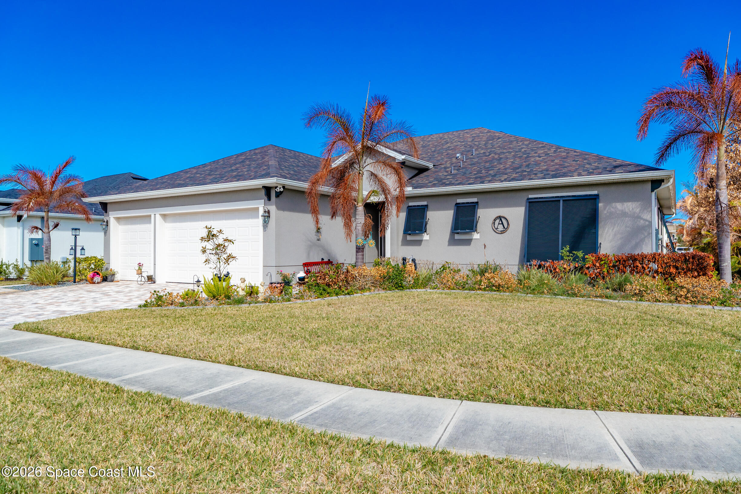 4160 Negal Circle Melbourne, FL 32901 - Photo 45 of 61 a front view of a house with garden